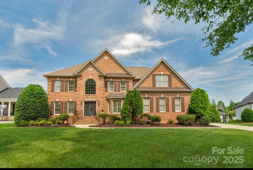 Beautifully maintained home in the highly sought-after gated community of Providence Downs. Nestled at the end of a quiet cul-de-sac, this home offers privacy and a fenced, level backyard—perfect for outdoor entertaining. The main level showcases a spacious open floor plan with a seamless flow between kitchen and living areas, a butler’s pantry, and a versatile den/office. The first (of two) generously sized primary suite is  located on the main floor and has private access to the back deck. 2 beautiful stone fireplaces are included in the family room and downstairs primary suite. Upstairs, you'll find a second primary bedroom, a large bonus/recreation room, and a dedicated home theater room—ideal for movie nights. New roof, irrigation system (2023), two tankless water heaters (2022), new downstairs HVAC unit (2025). New hardwood floors on upper level. Neighborhood walking trails, pickleball/tennis courts, inground pool, clubhouse, fitness center, playground, and ponds. Marvin Schools.