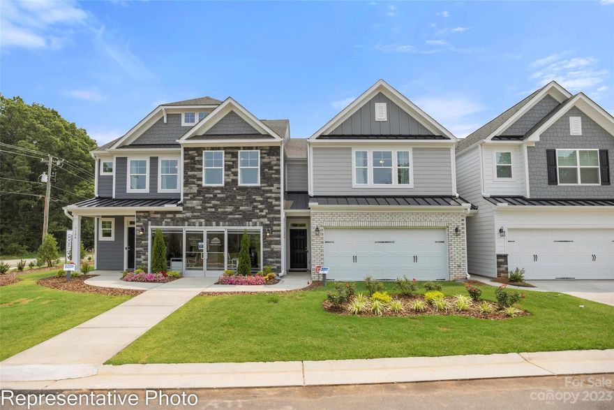 New townhomes in Harrisburg! This end-unit townhome has 3 bedrooms, 2.5 baths, and an attached 2-car garage.  The kitchen features soft-close drawers, quartz counters, a tile backsplash, and stainless appliances including a gas range. Beautiful and durable Enhanced Vinyl Plank flooring runs throughout the main level, and all baths feature quartz counters. The primary suite, located on the second floor, includes a large walk-in closet and the primary bath features a tiled shower with semi-frameless enclosure and a double-sink vanity. The second floor also features two additional bedrooms. Other extras include a drop zone and a tray ceiling in the foyer. Onsite New Home Specialist can provide guidance regarding estimated completion dates - however any dates provided are subject to change. Community amenities include a dog park, walking trails, a playground, pool, and cabana.