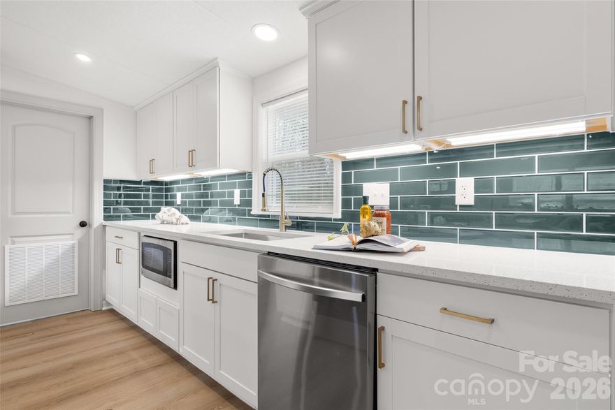 Beautifully updated  4 Bedroom, 2 Bathroom home on 1.6 acres in Rockwell! This spacious home offers the perfect blend of modern updates and peaceful country living. Inside you’ll find brand new LVP flooring throughout, fresh paint, and updated lighting including recessed lighting across the main living areas. The inviting living room features a cozy fireplace and opens into a fully renovated kitchen designed for both everyday living and entertaining.

The kitchen showcases white shaker cabinets, quartz countertops, new stainless steel appliances, tile backsplash, under-cabinet lighting, and an island with a cooktop and vent hood. A modern single-basin sink and open layout make the space both stylish and functional.

The primary suite features a beautifully updated bathroom with new dual vanities and plenty of space to unwind. Two additional bedrooms offer comfortable living space, while the fourth room provides flexible use as a home office, guest room, playroom, or bonus space (septic permit for 3 bedrooms). Additional highlights include a dedicated laundry room, new HVAC system, and new water heater for added peace of mind.

Situated on 1.6 acres, the property offers a large flat yard with plenty of room to enjoy the outdoors. Step out back to a deck and patio area that’s perfect for grilling or relaxing while taking in the quiet surroundings.

Don’t miss this move-in ready home offering space, updates, and privacy just minutes from town.