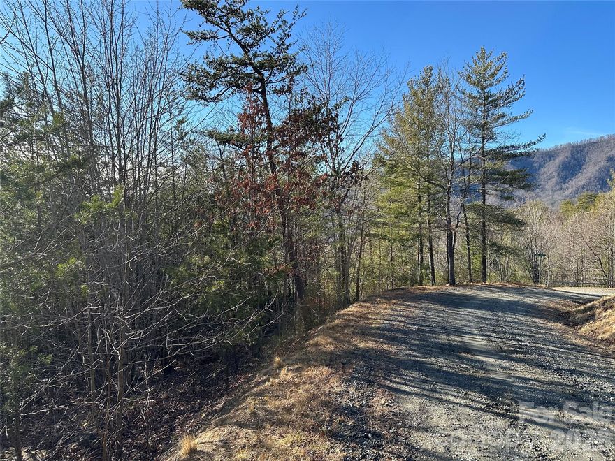 Tucked within the gated Fox Ridge community, this beautiful .66-acre wooded corner lot offers both privacy and flexibility for your future mountain retreat. Ideally positioned along Fox Ridge Trail and Sir Duke Drive, the property provides multiple access points and a peaceful natural setting surrounded by mature trees. Outdoor enthusiasts will appreciate the community’s hiking and biking opportunities, along with quick access to Pisgah National Forest, just a short drive away, where breathtaking long-range mountain views and endless recreation await.

The location places you within easy reach of many of Western North Carolina’s most loved destinations — approximately 10 minutes to the Blue Ridge Parkway, Linville Falls, and Linville Falls Winery, about 25 minutes to Lake James, and roughly 40 minutes to area ski resorts, making this an ideal basecamp for year-round adventure. Per the community CCRs, owners may enjoy short-term recreational use with camping permitted for up to 10 consecutive days at a time, offering flexibility while you plan your future build.