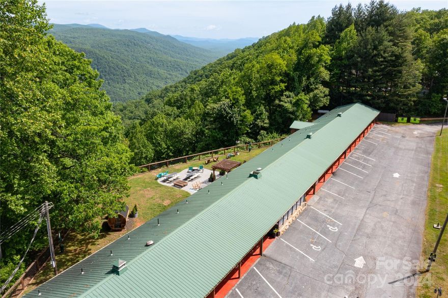 Once-in-a-lifetime investment opportunity! This iconic 25 room boutique motel sits atop a private mountain with convenient access to I-26 and a transformative view of 18,000 acres of pristine public lands. The business and facility have been revitalized over the past 3 years and are undergoing a curated room-by-room and campus redesign. Guests enjoy nostalgic motel vibes with modern touches, convenient access, stunning Appalachian sunsets and sunrises, dog-friendly options, remote work capability, and world class outdoor recreation.
Property/business offered for sale with FF&E/Brand IP/Goodwill. Operate as-is for a “working retirement” in the mountains, hold as an investment, or convert into a retreat or wedding venue. Excess acreage is a blank canvas for continued development, and the property is eligible for OZ Federal/State tax incentives.  

There are very few views like this on Planet Earth… how will you be its next steward?  

**NO Drivebys. DO NOT disturb guests or staff.**
