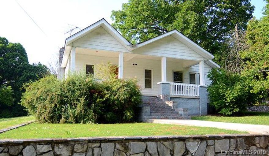 Imagine the possibilities in this cute little fixer upper!  Some of the renovations have already been started for you!  New roof, new heat pump and most of the windows have been replaced!  Just a little more work and this will be a gem.  Property has a HUGE kitchen, separate dining room and living room.  There are actually 3 bedrooms, but due to the age of the home there are not closets in all of them.  Tall ceilings and original hardwood floors.  Great in-town location- close to schools, churches and shopping.  Come see this charming home and make it yours!