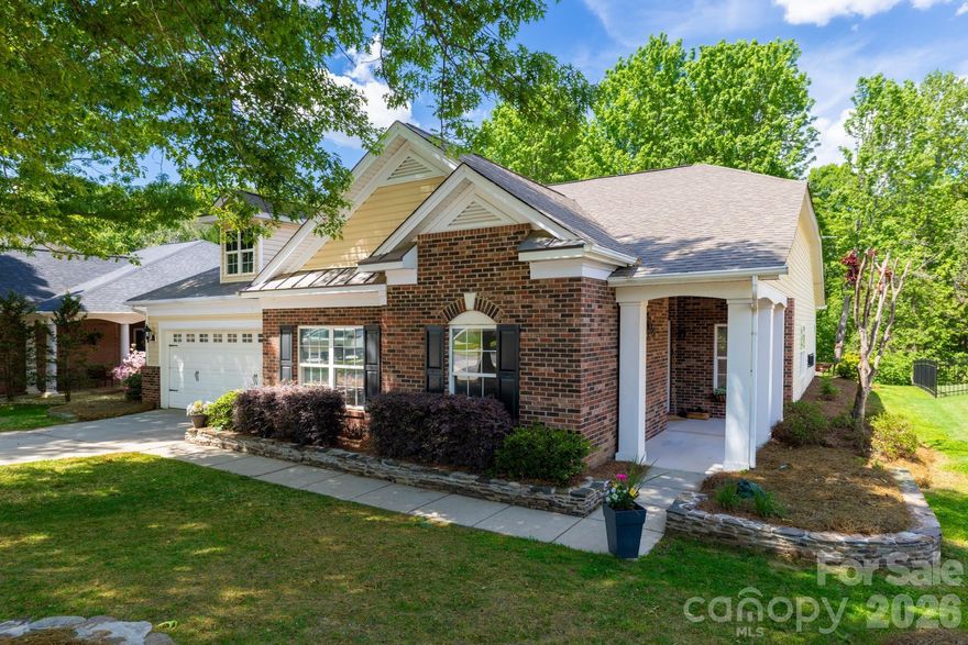 A stunning home featuring soaring vaulted ceilings, tasteful neutral décor, and gleaming ceramic tile floors throughout—all bedrooms boast plush new carpeting. The gourmet kitchen showcases sleek granite countertops and stainless steel appliances, while the spacious front room offers versatility as either a formal living or dining space. The original gathering room adjacent to the kitchen easily converts into an additional dining area.  

This thoughtfully designed two-bedroom split plan positions two bedrooms at the front of the home and two at the rear, ensuring privacy. Step out onto the screened-in porch to enjoy serene wooded views—nature’s tranquility right in your backyard. Freshly painted interiors complement the home’s modern appeal.  

Prime location: Effortless commuting to I-77 and Fort Mill Springfield Parkway, just 15 minutes to Carolina Place Mall, and a quick 10-minute drive to Carowinds and Cabela’s. Nearby dining options cater to every craving. Explore Regent Park’s exceptional amenities at: www.regentparksc.com/about-regent-park/amenities/