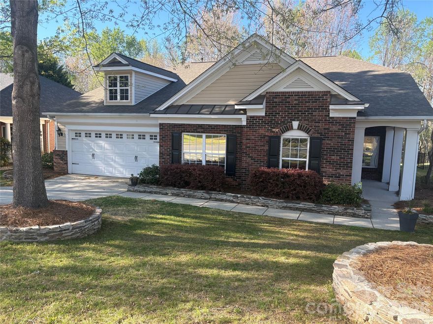 A stunning home featuring soaring vaulted ceilings, tasteful neutral décor, and gleaming ceramic tile floors throughout—all bedrooms boast plush new carpeting. The gourmet kitchen showcases sleek granite countertops and stainless steel appliances, while the spacious front room offers versatility as either a formal living or dining space. The original gathering room adjacent to the kitchen easily converts into an additional dining area.  

This thoughtfully designed two-bedroom split plan positions two bedrooms at the front of the home and two at the rear, ensuring privacy. Step out onto the screened-in porch to enjoy serene wooded views—nature’s tranquility right in your backyard. Freshly painted interiors complement the home’s modern appeal.  

Prime location: Effortless commuting to I-77 and Fort Mill Springfield Parkway, just 15 minutes to Carolina Place Mall, and a quick 10-minute drive to Carowinds and Cabela’s. Nearby dining options cater to every craving. Explore Regent Park’s exceptional amenities at: www.regentparksc.com/about-regent-park/amenities/