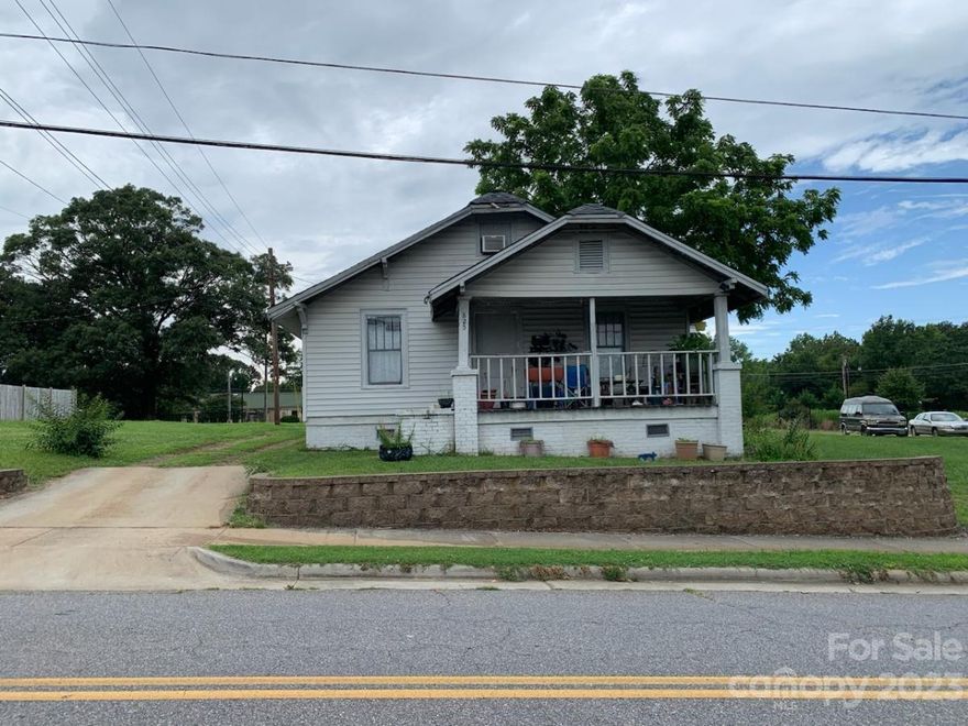 Great location. One block from busy Lenior Rhyne Blvd. This property is just above Hollar Mills. Lots of potential for with property. House with an additional lot. Property is zoned C-2. Home is currently a income producing rental property. Property is grandfathered as residential. Once converted to commercial it can no longer be used as residential.