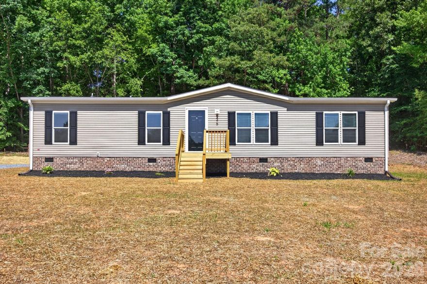 Welcome to this newly built 3-bedroom, 2-bath home set on nearly 3/4 of an acre with plenty of space inside and out.  The open-concept floor plan features a comfortable living area that leads into a well-appointed kitchen with stainless steel appliances, a center island, and an eat-in dining area. A spacious den off the kitchen offers extra room for entertaining, relaxing, or creating a flex space to fit your needs. The primary suite provides a private retreat with a garden tub, separate shower, and ample closet space. Two additional bedrooms and a large utility room add functionality and convenience. Outside, enjoy the oversized back deck overlooking the peaceful backyard. Ideally located near High Rock Lake for easy access to boating, fishing, and recreation.
