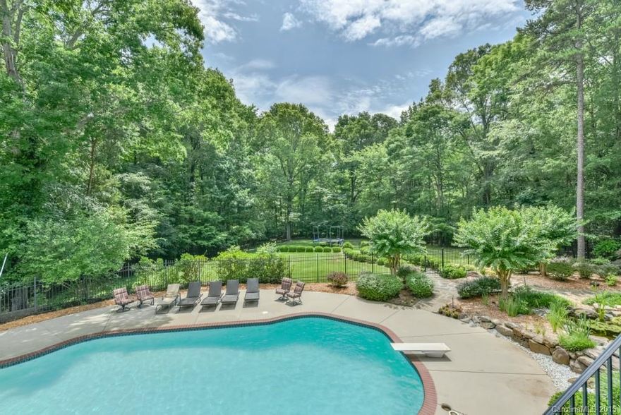 EXTRAORDINARY Simonini resort-like home w/ major renovations throughout: lights, baths, fixtures, flooring, hdware, carpet, fresh paint, hvac, wtr htrs.  Prof exercise rm, in-grd pool, steam room nestled on 2.15 lush acres in Quail Hollow!  Main Level Mstr Ste AND Guest Ste.  Grand coffered ceilings w/ in-deck lighting.  Fireplaces (4), windows, transoms galore.  Lower level:  Spacious BR stes (4) boasts elegant baths, walk-in closets.  Covered terraces.  Playground.  Priv Pond, waterfall.