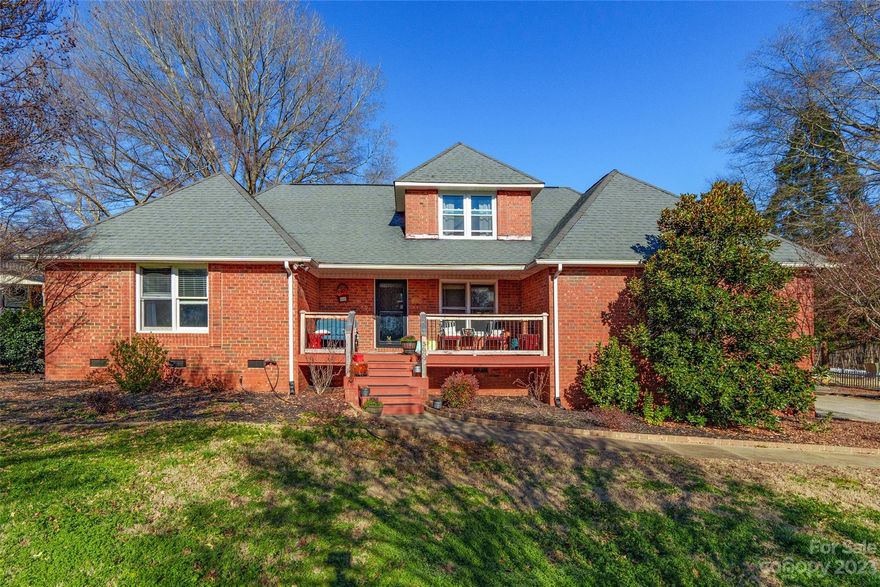 Experience the pinnacle of comfort in this 3 bedroom, 3 bath brick home, gracefully situated on over half an acre. The journey begins as the covered front porch beckons you. Inside, stunning wood floors extend throughout the main living areas while a snug gas log fireplace, and soaring vaulted ceilings can be found in the living room. The kitchen is a dream, boasting granite countertops, refinished cabinets, and stainless steel appliances. A generously sized primary bedroom with an ensuite bathroom, including a spacious walk-in closet is located on the main floor. Ascend to the upper floor where the 2nd bedroom offers two closets, ensuring ample storage space. Venture outside to the back covered screened porch & attached deck, where relaxation takes center stage, overlooking a koi pond & a stunning fenced in-ground pool. Enhancing the outdoor experience is a built-in grill and sink, perfect for entertaining. Offered as-is, seize the opportunity to make this home your own.