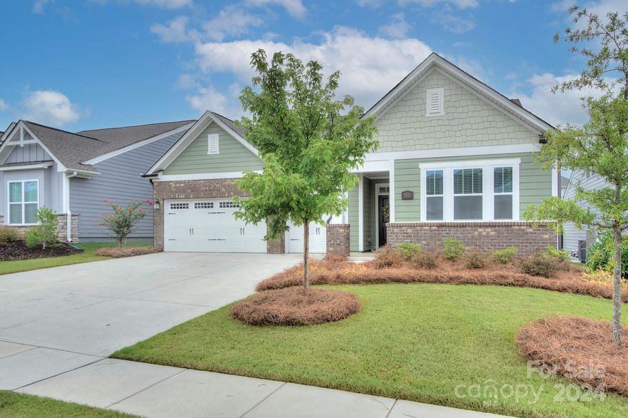 Welcome home! Discover this stunning ranch-style home featuring a level yard with a fenced back yard and professional landscaping. Inside, the gourmet kitchen boasts quartz countertops, an incredible custom tile backsplash, pull-out shelving in kitchen cabinets, a gas stove with a custom hood, convection oven, and a huge island. Custom Lee lighting and under-cabinet lighting enhance the space, while custom wood shelving in appliance pantry and a food pantry offer ample storage. The primary suite includes a walk-in shower, garden tub, separate water closet, and expansive closets with a built-in mirrored armoire. Enjoy an extended patio, screened porch, and a rare finished 3-car garage with epoxy floors. This home combines luxury and functionality in every detail. Washer, dryer, and refrigerator in kitchen remain! Community amenities include outdoor pool, clubhouse, playground, and picnic area. Nearby shopping and dining! A gem!