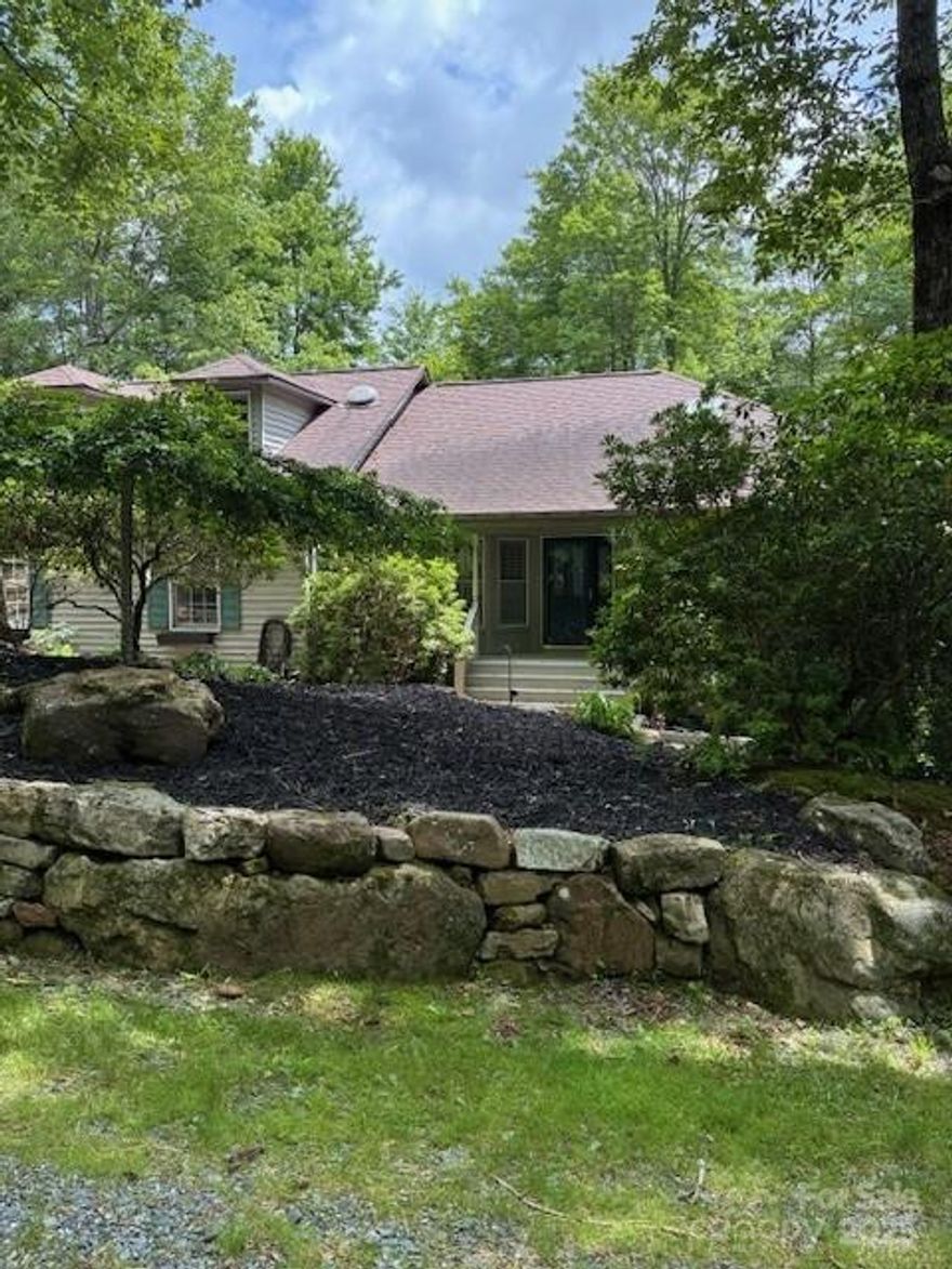 EXCELLENT VALUE for a solid and well-maintained traditional home in a convenient CONNESTEE FALLS location!  Lovely landscaping and curb appeal with great outdoor decks from which to enjoy the natural setting.  Cheerful eat-in kitchen open to spacious great room with nice dining area, and beyond that a simply delightful large sun room!  Split bedrooms and baths.  Large finished lower level is perfect for games, media room, entertainment, and overflow guests with Murphy bed and full bath.  Plenty of storage throughout and a surprise potting/workshop enclosed area with outside entrance.  Choose this well-loved home in a great Connestee location!