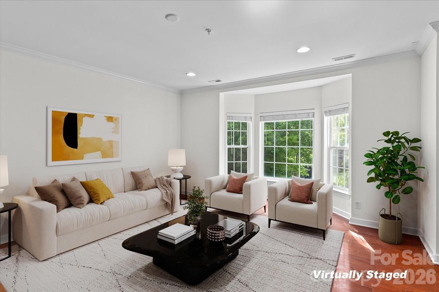 Freshly painted and turnkey 3-bedroom townhome-style condo in the heart of South End! Enjoy vibrant city living moments from the light rail, popular restaurants, local breweries and fitness studios. This townhome-style condo offers abundant natural light, an open layout and hardwood floors throughout the main living areas. The beautifully updated kitchen with custom backspash and large island and living space flow seamlessly, creating an ideal setting for everyday living and entertaining. Upstairs, you’ll find recently replaced carpeting and a spacious primary suite featuring dual closets and a spacious bathroom with walk-in shower and dual vanity.  An attached one-car garage, driveway parking, assigned parking space and guest parking spaces ensure effortless parking. Don’t miss this move-in ready home in one of Charlotte’s most dynamic neighborhoods!