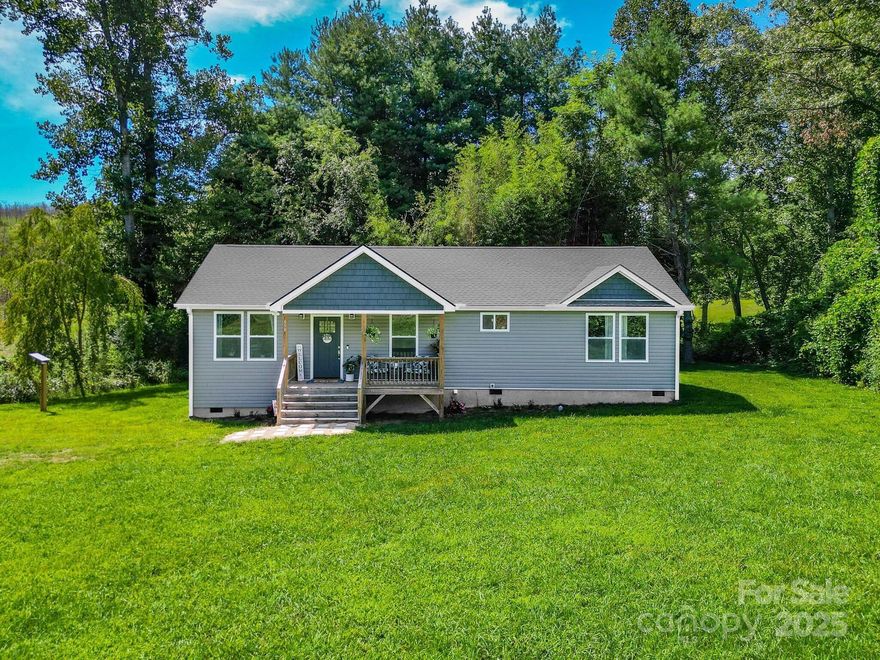 Welcome to 458 Summer Rd, Hendersonville, NC—a beautifully crafted 3-bedroom home that combines modern comfort with scenic country charm. Located just minutes from downtown Hendersonville, this property offers a peaceful retreat with everyday convenience. A spacious, flat yard provides endless possibilities for outdoor enjoyment, while a meandering creek adds a touch of tranquility to the backyard. Nestled beside a lush apple orchard, you'll enjoy natural beauty in every season. The home boasts a modern interior with high-end finishes, an open-concept layout, and the quality and peace of mind that come with new construction in 2023. Whether you're seeking a full-time residence or a weekend escape, this home is a perfect blend of style, serenity, and location. Don’t miss this rare opportunity to own a slice of Western North Carolina paradise!