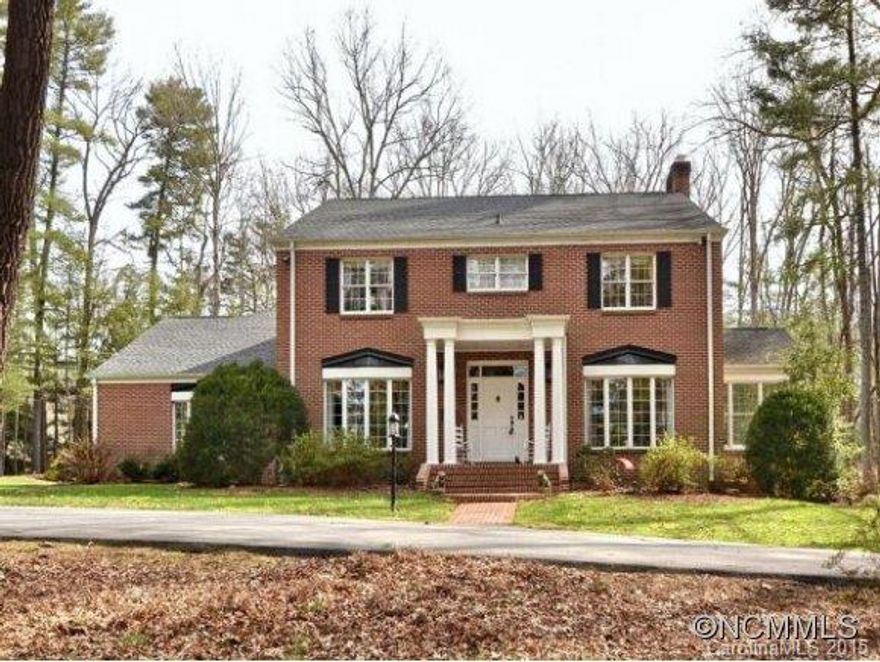 Spacious updated home on 2 level acres - complete apt. over 3-car garage. Gracious formal rooms. Spacious main level master suite, 4 or 5 bedrooms upstairs including second master. Light filled sunroom, hardwoods, wonderful new kitchen. Minutes to Biltmore Village, Biltmore Park,downtown Asheville, hospital.  Bikable/walkable neighhborhood with membership country club. Walk to Carolina Day School!