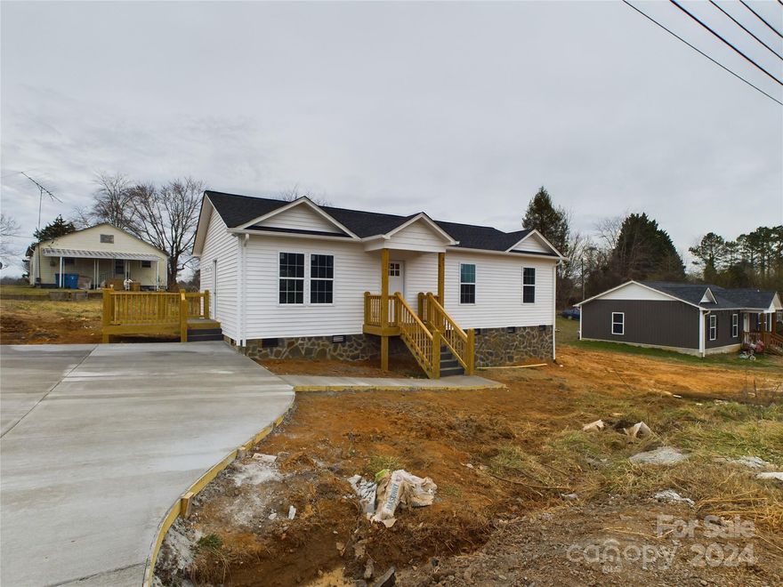 Location Location Location!  This 3 Bedroom/2 Bathroom NEW CONSTRUCTION home is now completed and ready to move in! A single level ranch home that is super convenient to US 321 for a quick commute to the Hickory or Lenoir area or a quick trip down 321 to Lincolnton, Gastonia or Charlotte (1 hours commute to CLT airport). Home features to include granite countertops, stainless appliance package including range, overrange microwave and dishwasher, custom kitchen cabinets, durable and attractive LVP flooring throughout, 2 full baths, and a concrete driveway with parking for 3 cars! 1 year builder warranty included. Updated interior pictures taken 1.16.2024