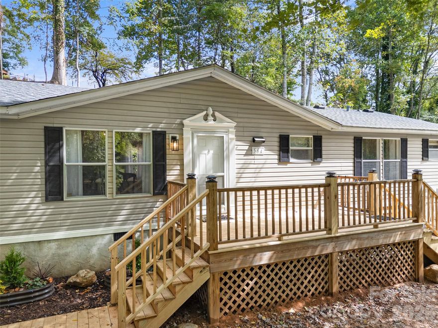 Sellers just made this one even better! Freshly installed brand new, bright kitchen countertops and energy efficient new windows handsomely framed with molding surrounds. These and other interior features, like smooth surface walls and new flooring gives the house the look feel and feel of a stick built house.
You simply must come see this charming like-new home in a delightful area of Saluda! Immaculate and exhaustively renovated, this one needs nothing to move in and enjoy low maintenance living in town at a great value. New flooring, interior wall finishes, paint, plumbing, appliances, flower beds, decking and walkway. The nearly one acre yard has been cleared of overgrowth to reveal possibilities to garden, play in the woods, utilize an existing alternate drive, or add a storage building or accessory dwelling unit. City water and sewer, fiber optic internet, peaceful and quiet setting but convenient to town or the interstate. Enjoy the quiet neighborhood and take a walk or golf cart ride into town for shopping, live music or dinner. 
Primary suite features privacy, a large walk-through closet and bathroom. Split bedroom floorplans offer personal space for kids or guests. Great, functional floorplan and endless tasteful updates.