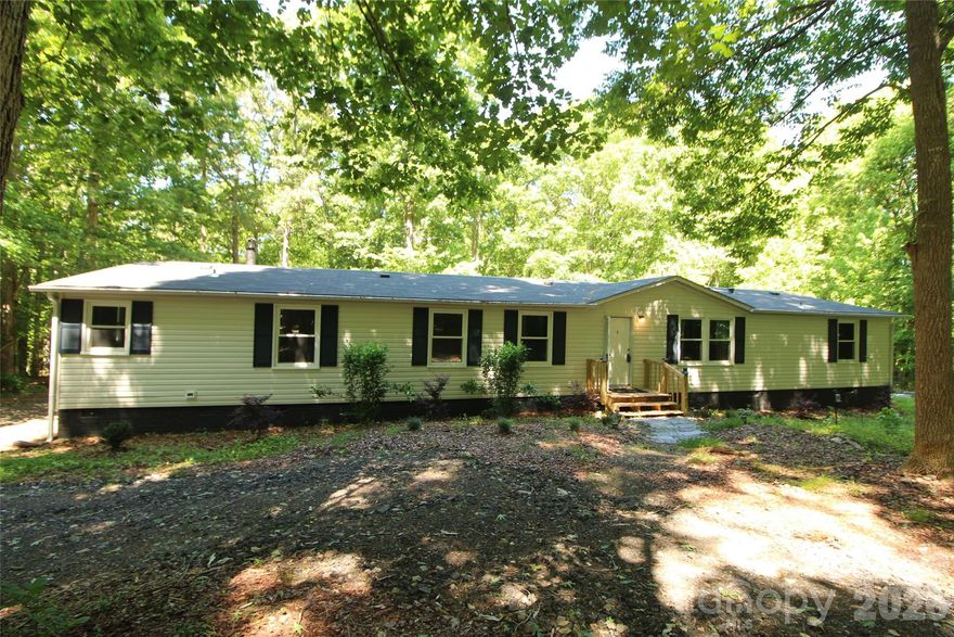 If you are looking for a renovated mobile home situated on 3.98+/- Acres then this may be the home for you! This home has approximately 2105 heated square feet.  Nice, split bedroom plan with 4 Bedrooms and 2 Bathrooms. This home also has 3 sitting areas. Wonderful kitchen with stainless steel appliances, tile backsplash, tile flooring, granite countertops and new white cabinets. Refrigerator, Washer and Dryer are not new but will remain. The primary suite features a sitting area, walk in closet, separate tile shower, separate bath tub, and double sinks. HVAC System and Roof were recently replaced. Enjoy the outdoors by spending time with you friends and family at the back yard fire pit.  Detached storage building will remain. Do not miss the opportunity to see this home!