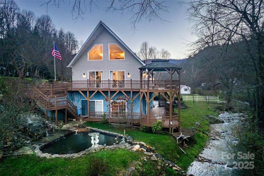 Year-round MOUNTAIN VIEWS! Seller OFFERING $10,000 credit at closing! Located on scenic Barkers Creek Road, this home is CREEK FRONT! 2 huge en-suite bedrooms, four bathrooms, with a downstairs walkout family room that is large enough for creating another bedroom or two if needed. It would make a fantastic vacation rental because of its location which is close to the Great Smoky Mountain National Park and the Casino. Outdoor space is a highlight with a DOUBLE DECK and gazebo overlooking the bold, rushing creek. This home also has a koi pond with waterfall just steps away. Natural sunlight shines in from the EIGHT sets of sliding glass doors throughout the home. A two-stall attached garage has plenty of space to create a workshop inside. There are two LARGE extra sheds on the property making this an ideal place for tools, equipment and storage needs. Set on 3/4 of acre, the home provides space and year-round enjoyment of its beautiful surroundings. New roof in 2025! This Barkers Creek retreat is the mountain getaway you have dreamed about. If you are looking for a full-time home or vacation rental with comfort, space, and natural beauty, this home delivers!