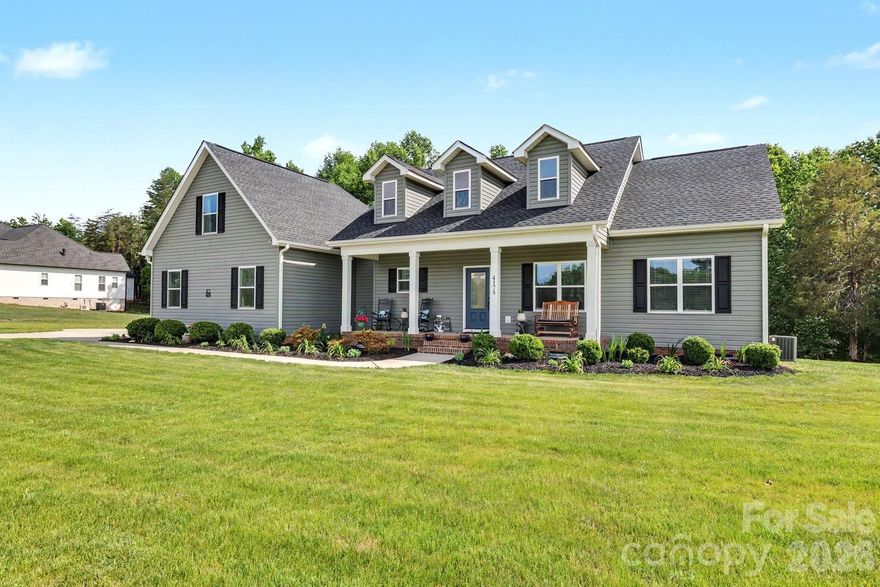 Welcome to Sanders Landing, one of Clover, SC  most sought after new custom home community~ ware charm, comfort, and space come together beautifully. Situated on a generous 1 acre lot this stunning 2104 square-foot home instantly captures your heart, beginning with the inviting rocking chair front porch..  step inside to a light filled living room, featuring soaring, vaulted ceilings, a cozy fireplace, and peaceful views of your private backyard with the perfect blend of warmth and openness. The kitchen is truly the heart of the home, thoughtfully designed with a farmhouse sink, stylish tile, backsplash, custom, cabinetry, stainless steel appliances, and a spacious island ideal for gathering, and entertaining. Just off the kitchen, the dining area offers a seamless flow for every day living and special occasions alike. The primary suite is a true retreat, complete with large walk-in closet and magazine, worthy bath featuring a beautiful walk-in shower and custom double vanity.  Two additional bedrooms and a full bath are conveniently located on the main level, along with a well placed laundry room, and pantry for added ease.  Upstairs, you will find a spacious fourth bedroom/bonus room with its own walk-in closet and full bath - perfect for guests, or a private office. Outback, unwind, and relax on the covered porch, where peaceful views and quiet 
moments await.  This home isn’t just a place to live - it’s a place to love.