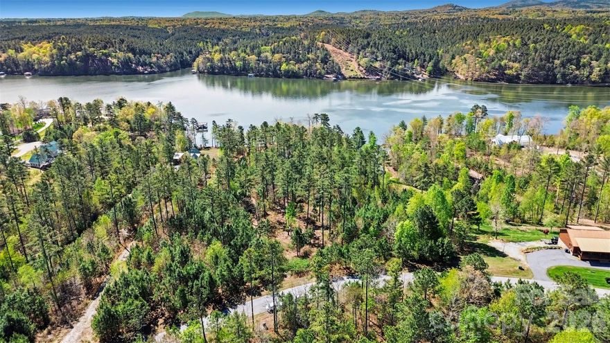 Make this stunning waterfront lot your own! Lot 48 is located in the private, gated Edgewater community on beautiful Lake Rhodhiss. This spacious 1.75-acre lot gently slopes, offering the perfect opportunity to maximize lake views and enjoy the peaceful surroundings. Experience the ideal balance of privacy and community living, all just minutes from Granite Falls and Hickory, with easy access to dining and shopping, while still enjoying a quiet escape.