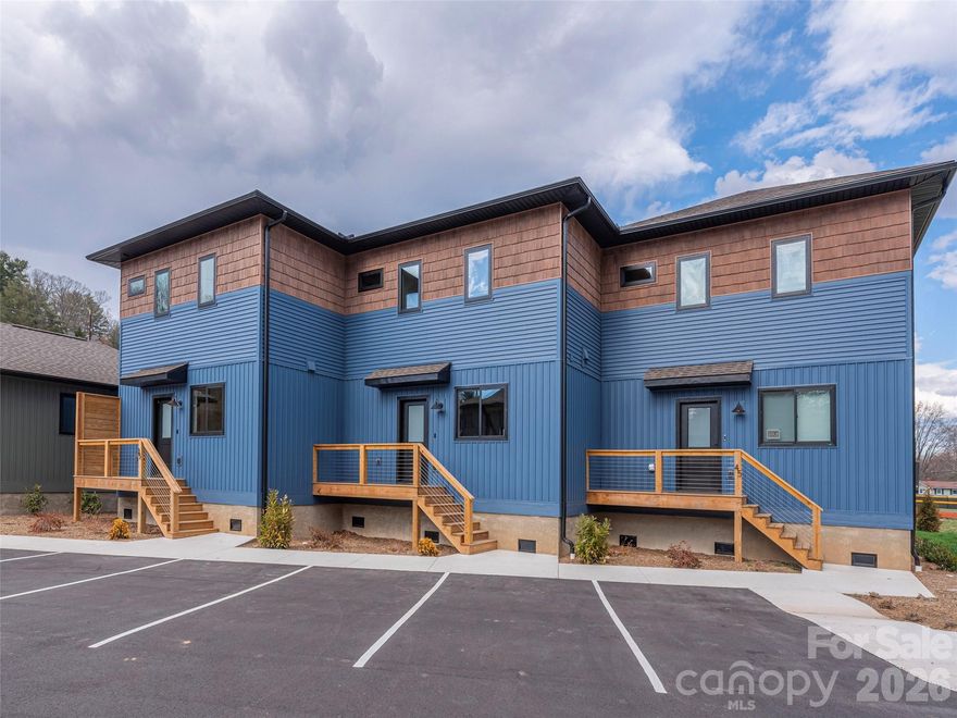 This charming new construction home, featuring the thoughtfully designed "Sycamore" floor plan, offers a spacious 2 story layout featuring two bedrooms with ensuite bathrooms & a half bath on the main level. Perfect for those seeking modern convenience in a fantastic location, this home comes with a one year builder warranty, 2 parking spaces and is perfectly situated in a vibrant new subdivision located in downtown Waynesville. At the Cottages of Richland Creek you'll find quality construction by Benchmark Builders and enjoy easy access to city amenities, thanks to the convenient sidewalk that leads right to downtown. The community features carefully crafted green space with scenic nature trail, community gardens, & peaceful creek access—perfect for outdoor lovers looking for modern convenience. Finalizing construction now! Bonus offering: 3K in seller paid closing costs with acceptable offers!