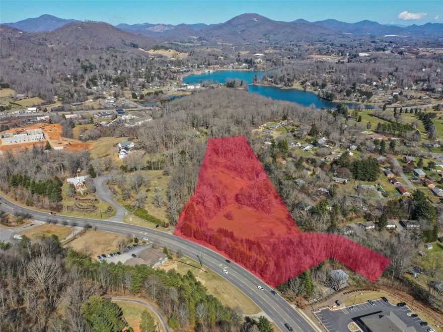 Large 9.29 acre parcel in the ETJ of Waynesville. City water and sewer available. Two points of access off Russ Avenue and 1 access point off Golf Course Road. Ideal for multi-family use, or will fit most commercial use. Includes PIN's: 8616-46-0500 & 8616-36-9614.