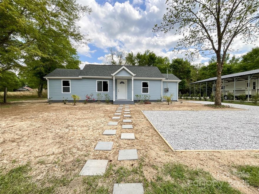 Check out how the owner transformed this home, adding a bedroom and 2nd full bath, a dining area, a laundry room and utility area. New layout, subfloors, floor covering, framing, drywall, paint, light fixtures, kitchen cabinets & countertops, bathrooms, windows, doors, electric panel and wiring, plumbing, and siding. Irrigation system!! Convenient stone/gravel driveway with turn-around section. Zoned rural by USDA and still convenient to Kershaw and only 30 minutes from Lancaster. Please note that the RV pad, cover, and RV are not located on the subject property parcel. The owner of the RV stores it on the lot to the right of the subject property.