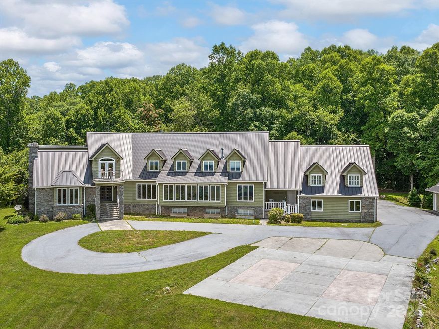 Extraordinary mountaintop home on 10 acres. Long-range, western facing views for spectacular sunsets! This home exudes old-world charm and elegance with exquisite cherry paneling, coffered ceilings, and stone accents. Featuring a geothermal HVAC system, standing seam metal roof, and your own helipad & hangar. Comfortably host large gatherings for holidays or a potential bed & breakfast with five luxurious ensuite bedrooms. Gather in multiple casual or formal dining areas, escape to the in-ground pool or hot tub, and end your day by 1 of 6 fireplaces! Basement includes 2nd fully equipped kitchen, family room, spacious fitness room, three bedrooms, & full bath. Remodeled 1-bedroom apartment is perfect for tenants or possible on-site caretaker. A common staircase provides separate entrance to all levels. Less than 10 miles to Asheville Airport and easy driving distance to the Biltmore Estate, Blue Ridge Parkway, and other popular destinations. PLEASE, NO drive-bys, showings by appt only.