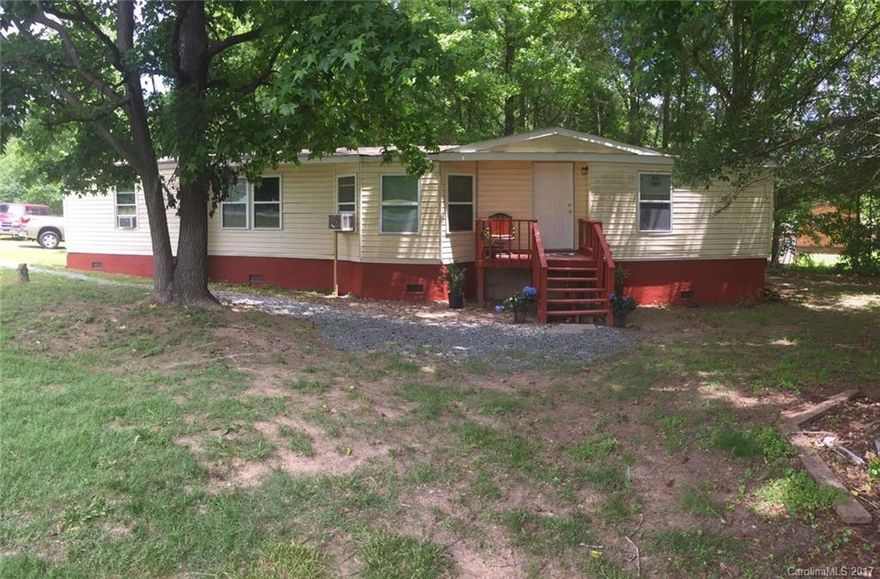 Great corner lot with manufactured home. Seller has done a lot of upgrades including new windows. Still could use some TLC but many improvements have been made AS IS SALE.