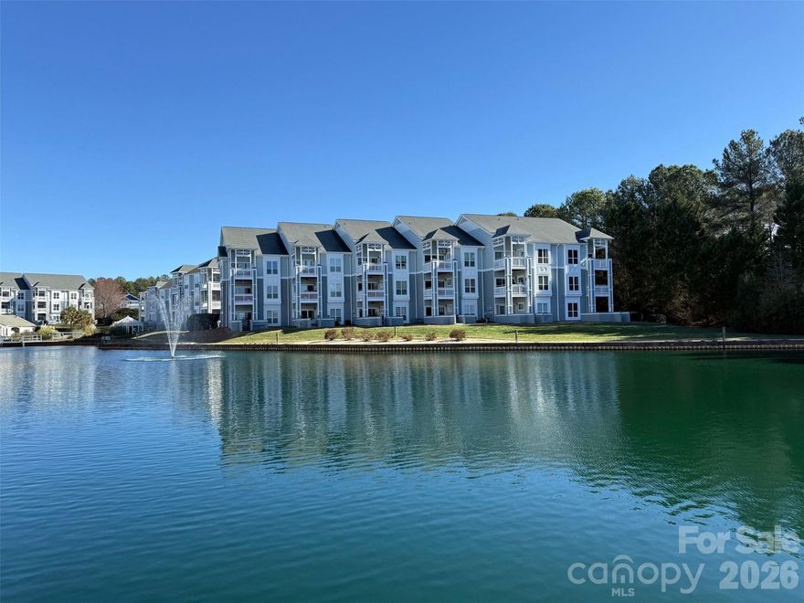 Enjoy serene waterfront living in this 3-bedroom ground-floor "zero step entry" end-unit condominium perfectly positioned for privacy and picturesque views in Admirals Quarters waterfront community. This spacious home offers easy, single-level living with abundant natural light and tranquil water vistas just outside your door. Step outside to a spacious private patio, perfect for morning coffee, outdoor dining, or relaxing while taking in peaceful waterfront views. With plenty of room for seating and entertaining, the patio extends your living space and offers a quiet retreat surrounded by nature. Inside features newer upgraded quartz kitchen countertops, soft-close cabinetry, stainless steel appliances, and thoughtfully selected finishes throughout. The bathrooms showcase tiled shower surrounds, while the primary bedroom en-suite offers a double vanity, providing both style and functionality. Located minutes from dining, shopping, and outdoor recreation, with convenient access to I-77 for an easy commute to Charlotte. This condo combines comfort with unbeatable convenience to enjoy nearby locations, such as renown Birkdale Village, Jetton Park, town of Cornelius greenways, and lake activity. Enjoy the fresh look of the freshly painted building exterior recently completed in January 2026. This community features a private marina, scenic pond with fountains and a walking path, ideal for morning strolls or evening relaxation. Residents also enjoy access to an outdoor pool, clubhouse, tennis court, fitness room, and kayak and paddleboard launch, making it easy to embrace an active, waterfront lifestyle.
Whether you’re looking for a full-time residence or a low-maintenance retreat, this end-unit condo offers the perfect blend of location, amenities, and peaceful surroundings. 30 lbs weight restriction for pets. Garage #14 can be purchased for an additional $30,000.