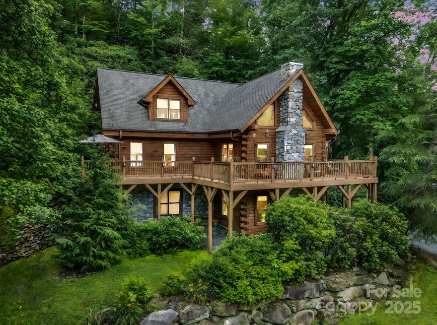 This home offers more than a sought-after location, beautiful design, and serene setting. The seller is offering owner financing with acceptable terms. This luxury log home is surrounded by the NC mountains and a rushing creek. Privacy and nature with this fabulous location as you gather around the firepit right beside Cedar Creek. Enjoy walks and picnics in the commons area. Open plan large enough to accommodate big family get-togethers. Plenty of space for families to come together and stay for holidays and celebrations. Beautiful logs inside with 2 rock fireplaces, two ideal features for a Carolina home in the mountains. Very large primary bedroom, with ensuite and sitting area. The finished basement has a living area with a fireplace, a gaming area, dining area, and half bath. Also includes 322 sq ft of unfinished daylight area that could be completed for additional heated sq footage. Groceries, golf courses, and restaurants are within 15 to 20 minutes. Rental history is available.