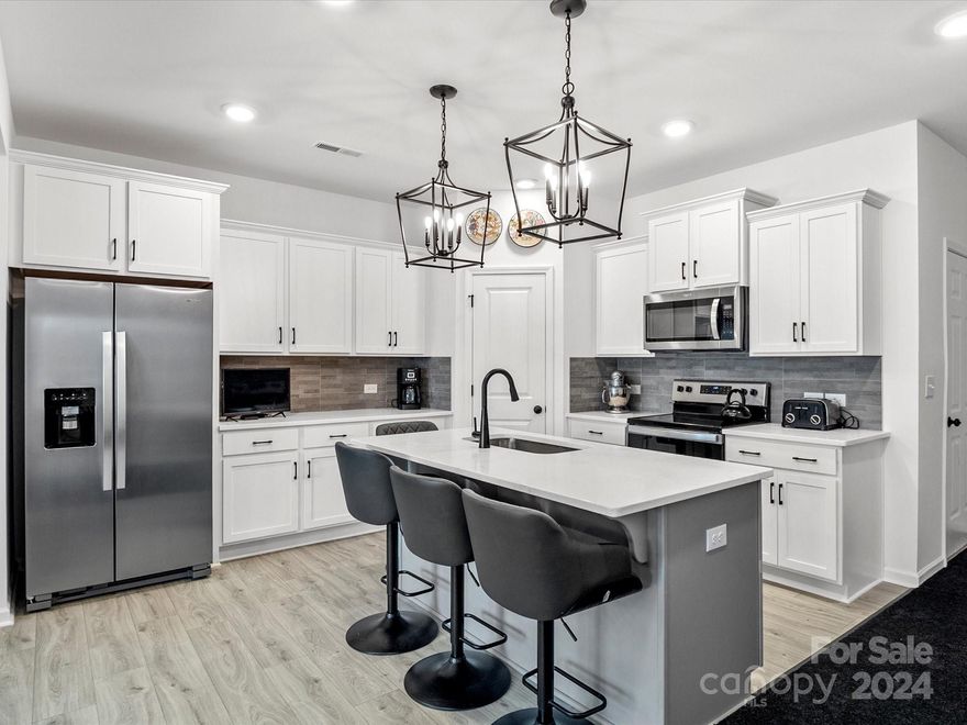 Why wait to build?! This townhome was completed in August 2023 and is ready to move into without the wait! Located in Clover, SC’s newest townhome community, Penley Place! You will love the Charlestonian style exterior, and all the upgrades inside! The community is just minutes from downtown Clover and all the small town feels it has to offer! Inside the open floorplan draws you in, the large living room and dining area is a perfect place for entertaining your family and friends while you prepare their favorite meals in the kitchen! The kitchen is light and airy with lots of counter and cabinet space, an island, quartz counters and walk in pantry! All kitchen appliances stay! Also located on the main floor is a half bath, coat closet and access to your 1 car garage! The main living area overlooks the back patio! Upstairs are 3 bedrooms and 2 baths and laundry room! The home has new blinds in all the windows and ceiling fans in all the rooms! Hurry home to 705 Bellmouth Road!