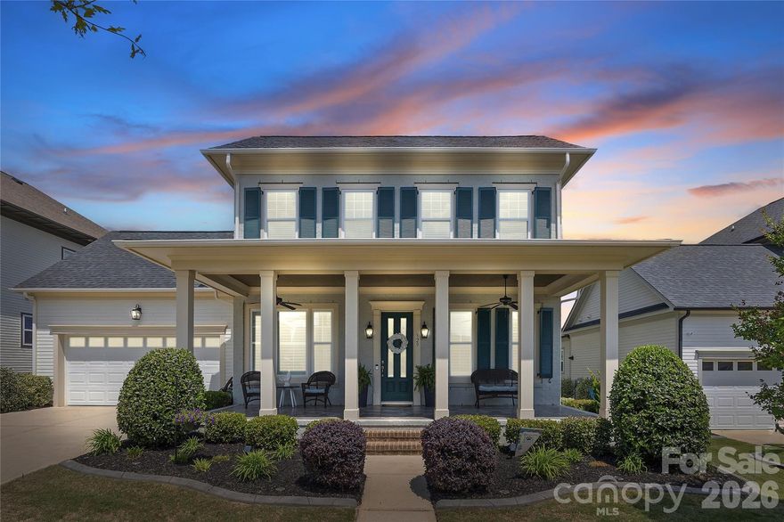 Welcome to 329 Sensibility Circle, a beautifully appointed luxury home in Fort Mill’s highly sought-after Masons Bend community. Built by the renowned Cunnane Group, this meticulously maintained 5-bedroom, 3.5-bath residence offers more than 3,200 square feet of thoughtfully designed living space, blending timeless Southern charm with modern family living. Elegant brick veneer accents, rich hardwood floors, crown molding, plantation shutters, and abundant natural light create a warm yet sophisticated atmosphere throughout.
Designed with both entertaining and everyday comfort in mind, the open-concept layout features a spacious great room with a gas fireplace, private office, formal dining area, and a chef-inspired kitchen complete with quartz countertops, stainless steel appliances, a large center island, and a sunny breakfast nook overlooking the backyard.The main-level owner’s suite offers a private retreat with a spa-like bath, while upstairs features four generously sized bedrooms, two full baths, brand-new carpet, and exceptional walk-in attic storage.
Step outside to an immaculately landscaped, fully fenced backyard designed for relaxation and family enjoyment. The covered extended patio creates the perfect setting for outdoor dining, entertaining, or quiet evenings surrounded by lush greenery and privacy. Residents of Masons Bend enjoy resort-style amenities including a clubhouse, fitness center, pool, playground, and scenic walking trails—all just minutes from top-rated Fort Mill schools, shopping, dining, and major commuter routes. 329 Sensibility Circle offers the perfect combination of luxury, comfort, and community in one of Fort Mill’s premier neighborhoods.