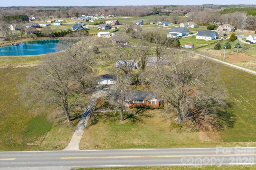 Nestled on 4.46 picturesque acres, this charming 1955-built home offers endless possibilities for country living, hobby farming, or agritourism ventures. Surrounded by open agricultural fields on both sides, the setting provides privacy, wide-open views, and the peaceful backdrop buyers dream about.

The sturdy, well-built home features vintage interiors ready for renovation—an ideal opportunity to restore its classic character or reimagine it with modern updates. With solid construction and timeless bones, the potential here is undeniable.

Behind the home, you’ll find multiple barns and storage sheds, perfect for equipment, animals, workshops, or creative business use. The layout and acreage make this property especially well-suited for a “you-pick” strawberry farm, flower farm, or boutique agricultural operation.

Whether you're looking to renovate and create your dream homestead, establish an income-producing farm concept, or secure usable acreage with valuable outbuildings already in place, this property is packed with opportunity. Rare combination of land, infrastructure, and vision-ready potential.