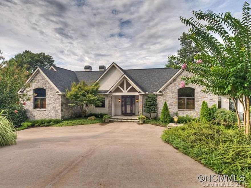 Stunning Custom Lakefront Home of Distinction at 384 Chapel Point Drive. Main Channel Lake Lure. Mountain VIEWS! 762 sq ft Carriage House. PRIVATE. 5 Luxurious En Suites in Home. His and Her Master Baths. Whirlpool. CHEF's KITCHEN. ELEVATOR. GYM. Steam Shower. Screened Room. Oak Floors. 5 Fireplaces. Greenhouse. Waterfall. Double Boathouse with Sundeck. Generator. Lush Landscape. Irrigation. Enviable Appointments and Details. Composite Decking.