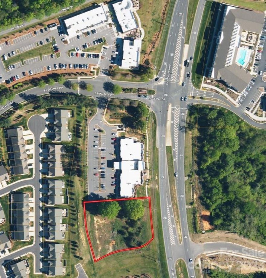 Prime Commercial lot on 521. Ready to build. Ideal location entering at the light at Bridgemill. Already zoned commercial. Medical, Shopping, etc are all suitable uses.