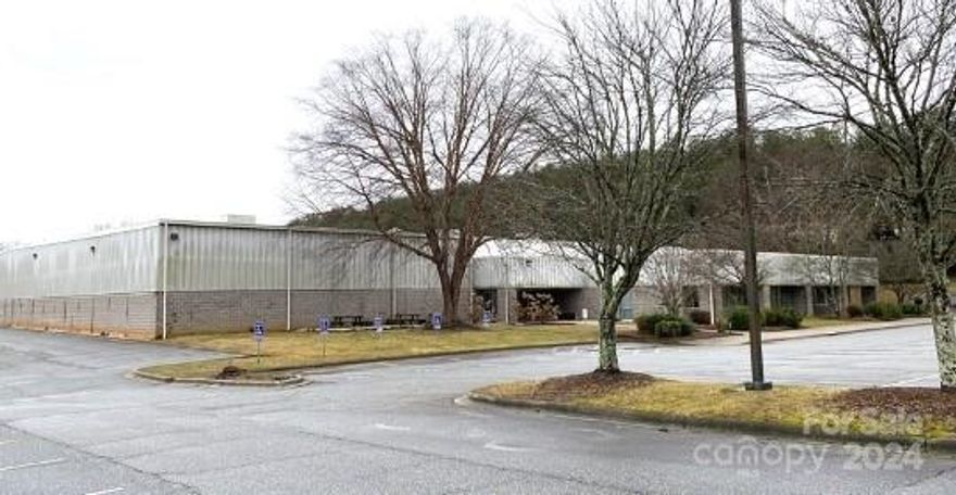 Immaculately maintained 51,271sf warehouse (33,000sf fully conditioned) on 4.5 acres in prime location.  Formerly occupied by Ocean-X.  3,336/sf of office space with 160 parking spaces.  New 20-year roof.  

Prominent, readily accessible location (signalized) fronting Brevard Rd.  Close to the Long Shoals intersection.  At the entrance to The Cliffs Walnut Cove.  Opposite the Borg Warner corporate campus.  

Parking and drives re-paved.  Exceptional value for a turnkey Class A facility in this location.  Priced well below replacement cost.

Available for lease at $9.50/sf NNN.