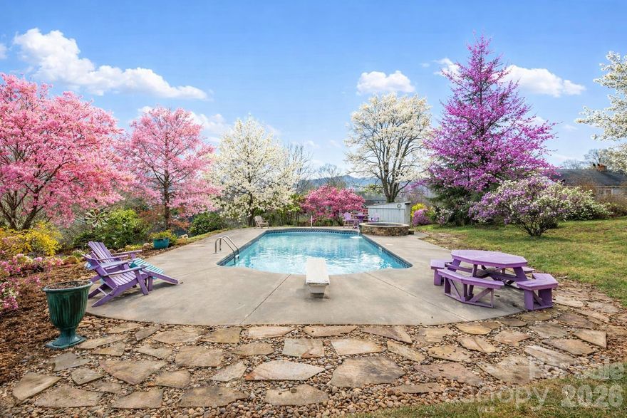 Welcome to a truly special property in the heart of Black Mountain priced below appraissal. Less than a mile from downtown and set on just under an acre, this rare offering brings together historic character, modern comfort, and the kind of mountain lifestyle people dream about. Whether you are seeking multi generational living, a unique investment opportunity, or a personal retreat, this home opens the door to endless possibilities.

The original 1907 front home immediately welcomes you with warmth and charm. Hardwood floors, a Jotul gas stove with a stone hearth, and a comfortable layout create a sense of nostalgia and story. This portion of the home includes two bedrooms, two full baths, a full kitchen, dining room, living room, and its own separate laundry. It feels like a peaceful mountain cottage, lovingly preserved and thoughtfully updated.

Step into the back home, built in 2005, and the energy shifts to bright, open, and airy. Hardwood floors, tongue and groove wood walls, and an inviting open living and kitchen area make this space ideal for gatherings. The kitchen features custom cabinets, tile surround, a farmhouse sink, and gas oven and stove. A pellet stove adds cozy ambiance. With three bedrooms and three baths, including a main level primary suite and a beautiful tiled foyer with custom stained glass, this portion of the home feels like a modern mountain retreat seamlessly connected to the past.

Outside, the property transforms into your own private oasis. Mature landscaping, perennial gardens, and a large fenced yard create a peaceful, natural setting. Take a late night soak in the salt water hot tub, cool off with a plunge in the pool, breathe in the mountain air, and watch the colors shift across the sky. This is a place where families gather, friends reconnect, and unforgettable memories are made.

Perfect for long term rental, vacation use, or extended/multigenerational  family living, this home offers versatility without sacrificing warmth or character.  Handicap accessible from the side entrance.  Its location adds even more value, with downtown Black Mountain, Lake Tomahawk, and local hiking and biking trails just moments away.

Black Mountain is known for its welcoming community spirit, walkable downtown, vibrant arts scene, and endless opportunities to enjoy the outdoors. From strolling around Lake Tomahawk to exploring local shops and galleries to discovering new favorite restaurants and breweries, the town offers a lifestyle rooted in connection, creativity, and mountain beauty.


With its blend of historic charm, thoughtful renovations, outdoor amenities, and unbeatable location, 104 Enthoffer St offers not just a home but a place to belong. A place to breathe. A place to build a life filled with meaning and mountain moments.