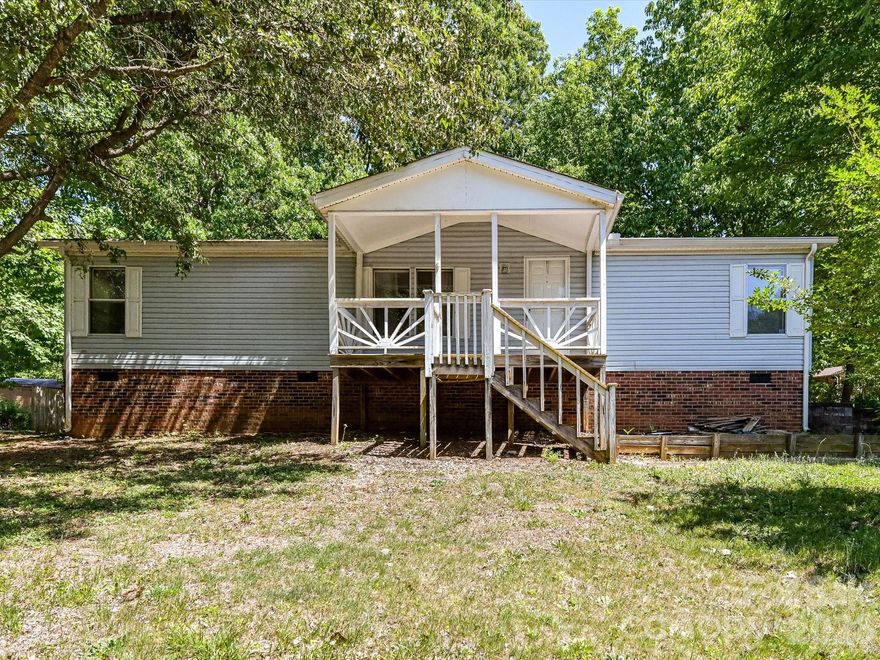 Set on a generous 3/4 acre homesite, this single-level home offers space, privacy, and everyday convenience in an established community with no HOA (there are CCRs). Enjoy peaceful outdoor living from two covered porches that take in the serene surroundings. The location is ideal for commuters, with easy access to the soon-to-be-completed Hwy 16 extension.  The home has a split bedroom floor plan, with the primary and ensuite on one side and the two secondary bedrooms and second full bath on the other.  Additional highlights include a detached storage shed and a covered area for lawn equipment, providing practical solutions for tools and outdoor gear. Major updates have already been taken care of, including a roof replacement in 2016, gutters in 2019, and a well pump and pressure tank installed in 2014. Zoned for Balls Creek and Bandys schools, this home is ready for its next owner.