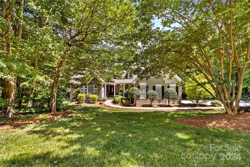 Welcome to Lake Living on 1.82 Acres & NO HOA! Custom Lakefront Home is located "South Of The Bridges" on Lake Norman. Hop in your Boat and in just a moment you're out to Main Channel and Big water Fun! Beauty and nature surrounds this 1.5 Story Home for the ultimate in Privacy.  Enter the covered Front Porch, and through the entrance, and a two story wall of windows greet you. Natural light fills the two story Great Room, which is Open to the Dining and Kitchen. Newly refinished Light Hardwoods gleam, and the Kitchen shines with New Quartz Counters & New Stainless Appliances.  Casual Dining overlooks the Lake or enjoy morning coffee at the Counter. The Dining Room is perfect for Celebration meals. Dreamy Primary Bedroom is lakeside, for peaceful private views each morning. The Primary Bath is a Spa escape, with a whirlpool soaking Tub, separate Glass and Tile shower & Double Vanity. Huge Walk In Closet w/ professionally organized Shelving. A Must see Lake Home on Acreage!