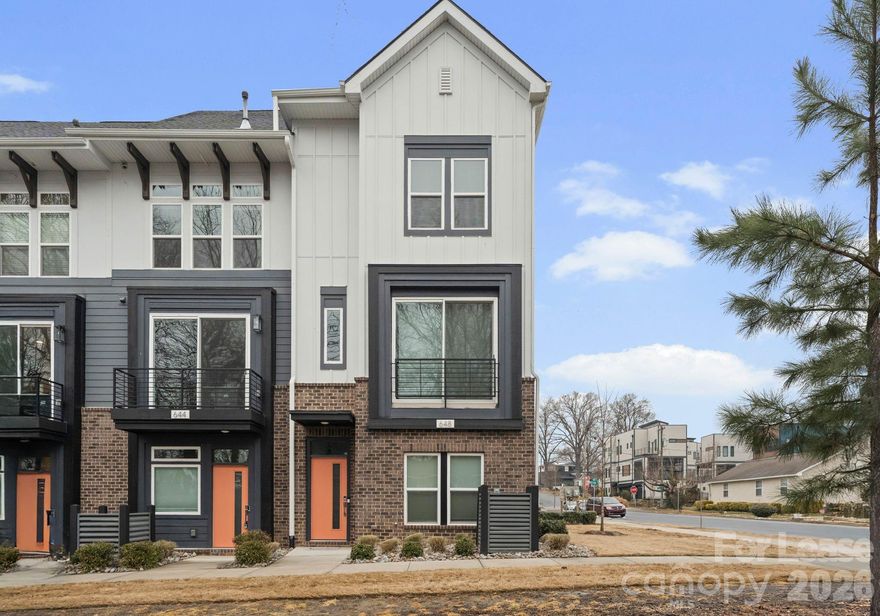 Now available and fully furnished with upgraded furnishings, this contemporary end-unit townhome in West End Towns offers turn-key living just minutes from Uptown Charlotte. The popular Sorrento plan spans approximately 1,951 square feet across four levels and features 2 bedrooms, 2 full baths, and 2 half baths, with a flexible entry-level space and powder room that is ideal for a home office, gym, or additional living area, plus an attached rear-entry one-car garage. The main living level showcases an open-concept layout with wide-plank flooring, abundant natural light, and a bright, modern kitchen featuring a large island with seating, white cabinetry, quartz countertops, tile backsplash, stainless appliances, and elevated finishes throughout. Upstairs, the bedroom level offers two well-appointed suites for privacy and comfort, including a spacious primary with walk-in closet and a beautifully finished bath. The top floor provides a generous recreation room that opens to a private rooftop terrace—perfect for entertaining, relaxing, or enjoying open-sky views—creating a rare indoor/outdoor lifestyle component in an urban townhome setting. West End Towns is ideally positioned less than two miles from Uptown with convenient access to I-77 and I-277 and close proximity to Charlotte’s West Side destinations, greenway access, parks, breweries, restaurants, and the energy of South End and LoSo. Available immediately; fully furnished.