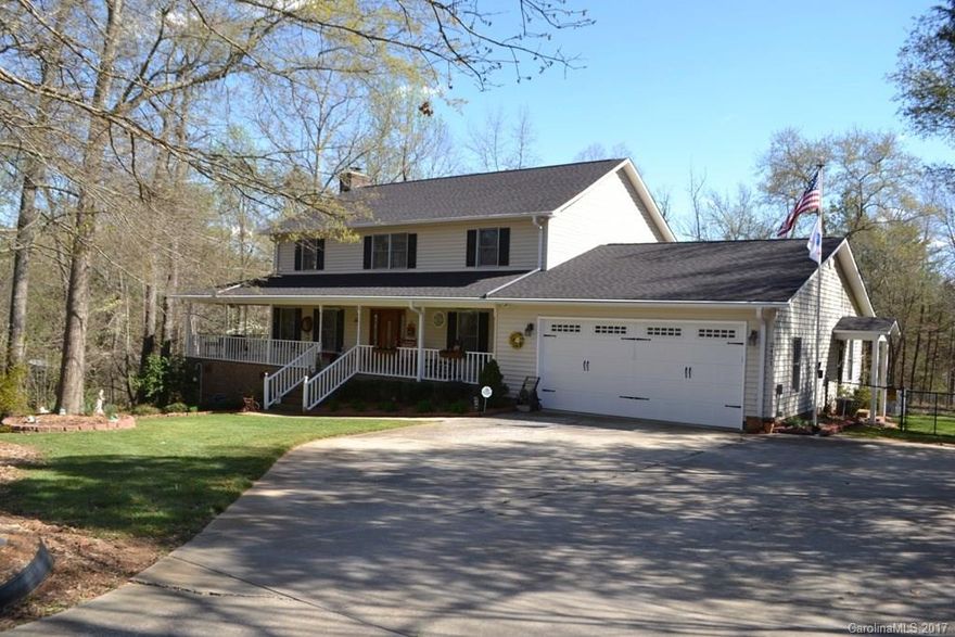 Pride of ownership shows!  This pristine 2 story home is situated on a large 1.99 acre lot in an established neighborhood. Wrap around porch over looks beautiful yard.  Hardwood floors, formal dining, and spacious great room with gas log fireplace.  Granite kitchen w/ new stainless appliances, and work island.  All bedrooms have plenty of room for large furniture. Deck w/ gas hookup, newer garage door, newer roof with gutter gaurds, and a long driveway for extra parking.