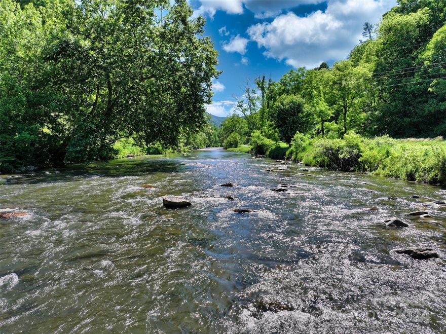 Spectacular 27.23 +/- acres of unrestricted land in Yancey County – this lovely old farmstead has it all!  Frontage on the Cane River, lovely hidden mountain meadows, multiple potential homesites, gorgeous mountain laurel, majestic mature trees, abundant wildlife, a spring, rich soil, and a ridgeline with views all the way to Bald Mountain!  The existing old homeplace is in the Cane River flood plain but this flat river frontage is suitable for other recreational or agricultural uses. The current resident, who grew up farming this slice of Appalachian heaven, wishes to sell subject to a free lease back the old homeplace for the remaining duration of his life. Take ownership of this piece of Appalachian history and make it your own homeplace to pass to future generations of your family!