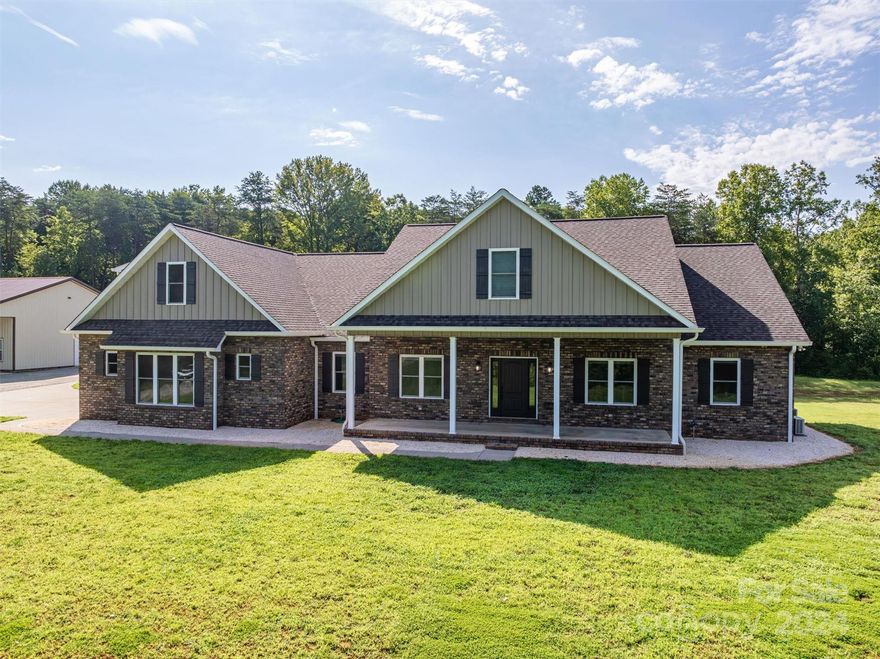 Every now & then, a house comes along that's more than just a collection of features—it’s a true home. This is that home. Imagine a space where interests can be nurtured, styles blend seamlessly, & convenience & comfort reign. Almost 12 acres in desirable North Lincoln, w/ nearly 4,000 sqft finished living area, plus 4,426 sqft ready for expansion, no shortage of space! Great room layout is inviting & open, perfect for both relaxation & entertainment. Upstairs, you'll find a setup for a second master suite, bonus room & storage, while the walk-out basement offers endless possibilities. The detached building is a dream come true for those needing extra storage, a separate living space, an RV hookup & additional covered parking. Let’s not forget the stunning 28,000-gallon saltwater pool, complete with a slide, lounge area, & shaded spots for those sunny days. This home isn’t just a place to live; it’s a place to make memories. Dive into the opportunity and discover all this home offers!