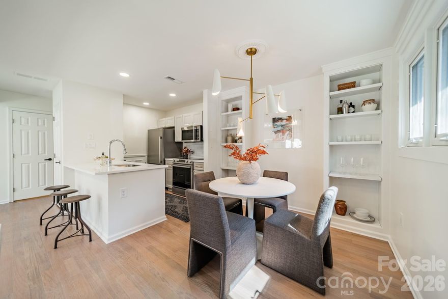 Impeccably renovated Uptown condo with professionally curated selections in the heart of the Queen City! This highly sought after end unit is a rare offering, with it's spacious primary bedroom with vaulted ceiling! Natural light fills the open floor plan, highlighting refinished wood floors, crisp, fresh paint and and thoughtful updates throughout. The kitchen stands out with Quartz countertops, new cabinetry dressed with gold hardware, stainless steel appliances, and a glazed tile backsplash. It overlooks the living area and private brick-walled patio, creating a connected, easy flow for everyday living and entertaining. Built-ins in the dining room provide both style and functionality. The primary bedroom is dreamy, with soaring ceilings and two closets, including a walk-in and a second dedicated closet that finally gives your shoe collection the space it deserves! Flawlessly executed, renovated bathroom with black and white marble floor tile, porcelain shower tile and vanity in the perfect shade of sage and gold sconces give a perfectly subtle nod to art deco design. A spacious secondary bedroom with seating area provides the flexibility of a home office, gym, or comfortable space for guests. Enjoy the courtyard with brick privacy wall and outdoor storage closet. Enjoy summer weekends in the community pool with your new neighbors. A dedicated parking space means no time spent searching for a spot and no paying for Uptown event parking - priceless! Walk to restaurants, shopping, grocery store, green spaces and all of Charlotte’s sports and entertainment! Easy highway access makes getting out of town a breeze! Welcome Home!