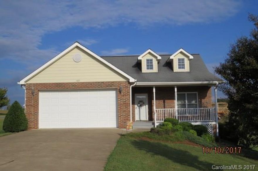 Beautiful low maintenance brick home in Sparks Crossing (a 55 & older community).  Open floor plan with beautiful hardwood floors, gas log fireplace and cathedral ceiling in LR. French doors lead to screen porch and nice deck. Home is handicap accessible.  Sparks Crossing offers two stocked ponds, paved roads and underground utilities. Great location that is convenient to shopping, hospital and major highways.