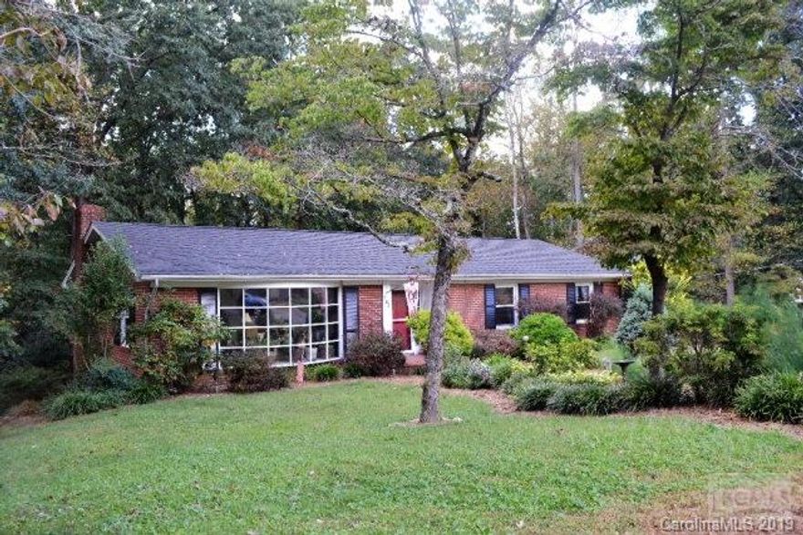 Well appointed 3BR/2BA brick ranch located in the heart of historic downtown Valdese!  Within walking distance to dining, shopping, and entertainment.  Spacious foyer opens to large living room featuring gas fireplace and oversize picture window allowing lots of natural light throughout.  Formal dining room comfortably hosts large dinner parties and conveniently opens to spacious kitchen with abundant cabinet/counter space and informal dining.  Large hallways open to full bath, bedroom and king-size master suite with his/her walk-in closets, and ensuite bath.  Beautiful hardwood floors throughout living areas and bedrooms and ceramic tile in kitchen in baths.  Full, finished basement with family room, bar and additional bedroom.  Unfinished space would make a great future bath.  Attached, double car garage in basement.  Fully fenced back yard and patio makes great space for pets and entertainment.