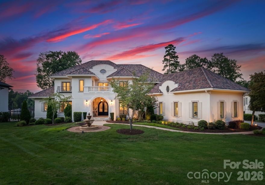 Welcome to "Villa Bianca," an extraordinary waterfront estate nestled within The Point on Lake Norman. Set on nearly an acre with sweeping, year-round water and golf course views, this timeless white-stucco residence makes an unforgettable first impression from the moment you arrive. Inside, soaring ceilings, refined architectural details, and beautifully curated finishes create an atmosphere of effortless elegance. The primary suite is conveniently located on the main level, offering a serene retreat with spa-like comforts. At the heart of the home, a true chef’s kitchen features custom cabinetry, an oversized island, and top-of-the-line appliances—seamlessly flowing into expansive living and dining spaces designed for both everyday living and elevated entertaining. Upstairs, generously sized bedrooms, a private study, a cozy library, and a spacious bonus room provide flexibility and comfort. The fully finished walk-out basement is an entertainer’s dream, complete with a second full kitchen, recreation and living areas, and a home theater—perfect for hosting guests or creating a private retreat. Step outside to your own resort-style escape, where breathtaking sunsets frame Lake Norman and the surrounding golf course. Enjoy the in-ground pool and spa, multiple outdoor living spaces, and a private dock with boat lift, offering effortless access to lake life at its finest. Located in one of Lake Norman’s most coveted communities, residents of The Point enjoy world-class amenities including golf, tennis, fitness, walking trails, and lake access—just minutes from dining, shopping, and Charlotte. A rare offering of timeless architecture, refined luxury, and unmatched lifestyle—Villa Bianca is truly one of one.