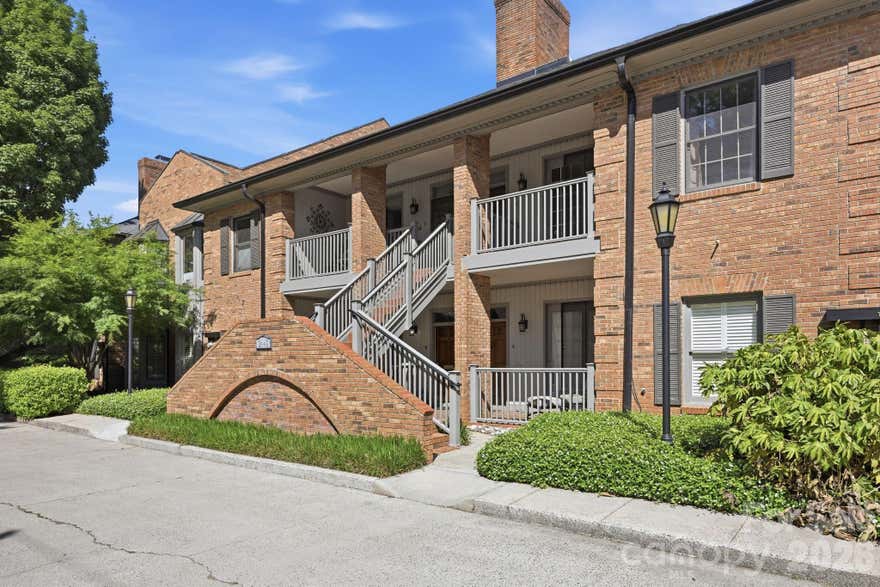 Thrive in the beautiful, historic neighborhood of Myers Park — this beautifully renovated 2-bedroom condo blends classic surroundings with fresh, modern style. You’re just moments from neighborhood favorites like Selwyn Pub, the scenic trails of Freedom Park, tree-lined Queens Road West, and the winding paths of Little Sugar Creek Greenway — perfect for morning strolls, bike rides, or a quick escape into nature beneath Myers Park’s iconic canopy of trees.
Effortless living begins with easy main-level access and two nearby designated parking spaces (#23 & #24). Inside, the updated kitchen offers both function and style with quartz countertops, generous soft-close cabinetry, stainless steel appliances, a brand-new dishwasher, and space for a cozy dinette. The open living area is warm and inviting, anchored by a wood-burning fireplace with flexible dining or work-from-home space.
The primary suite features a walk-in closet and a beautifully updated ensuite bath with a large walk-in shower and frameless glass door. A spacious secondary bedroom and full hall bath provide comfort for guests or everyday living. Gleaming hardwood floors and fresh paint create a crisp, move-in-ready feel throughout, while the washer, dryer, and refrigerator all convey for added ease.
Step outside to your covered terrace — an ideal spot for morning coffee or evening unwinding. HOA dues include water and landscaping, keeping life refreshingly low maintenance. Perfectly positioned between SouthPark and Center City, this home offers the very best of Charlotte living right at your doorstep.