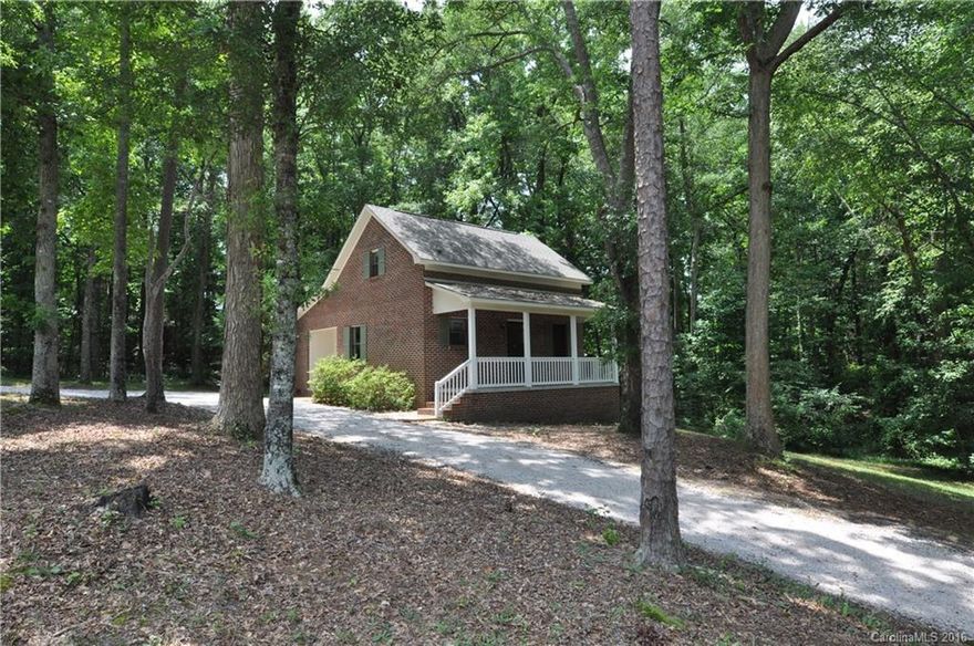 2BR/2BA BRICK 2-story. Remodeled charmer! MBR down. Aprox 1.5ac. Beautiful woodlands. Bright interior. Spacious great rm. Faux granite kitch counters. Tile bcksplash. Covered side entry. Fresh carpet & paint. Upstairs bedrm or bonus w/ 2nd bath. Attic storage. 6x22 rocking chair porch - super view! NEW roof '15, water htr '13, plumbing 13', low-e windows '14, doors 16'. Lush yard & terraced gardens & paths. Wonderful spot for future vegetable garden & fruit trees. NO HOA! Stylish county living.