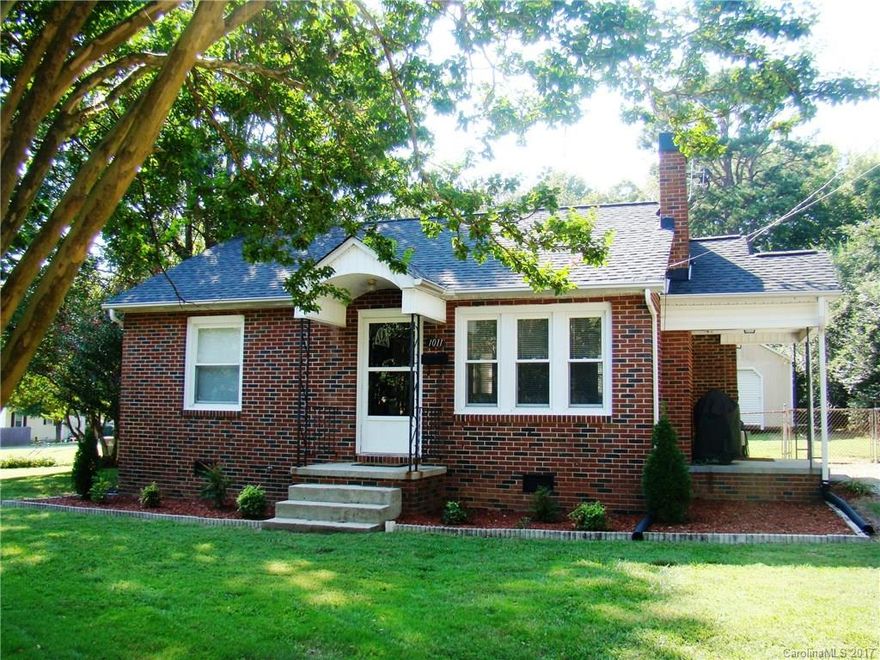 Cute as a doll house & move-in ready, this full brick home is nicely updated & nestled on a quiet street; Perfect blend of modern & classic finishes throughout; Totally remodeled -- roof, windows, HVAC, cabinets, water heater, tile shower, plumbing & electrical fixtures; Kitchen features SS appl’s including smooth top range, built-in microwave & refrigerator; Nicely landscaped with large, fenced back yard; HUGE 16’x24’ insulated outbuilding -- perfect for workshop, storage or man cave; W/D incl